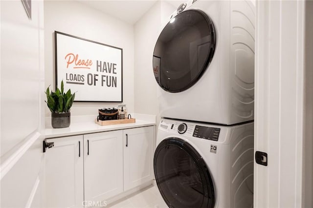 15218 Janine Dr Unit 2, Whittier, CA 90605 - laundry area with stacked washer / drying machine, cabinet space, and light tile patterned flooring