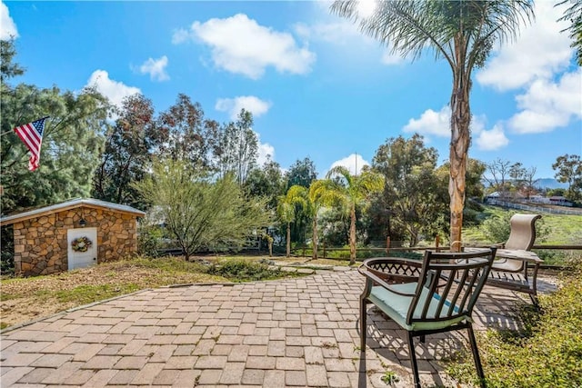 30451 San Pasqual Rd, Temecula, CA 92591 - view of patio / terrace with view of scattered trees