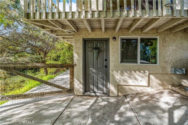 30451 San Pasqual Rd, Temecula, CA 92591 - doorway to property featuring stucco siding