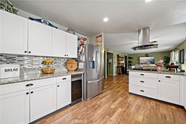 30451 San Pasqual Rd, Temecula, CA 92591 - kitchen featuring stainless steel fridge, island exhaust hood, light wood-type flooring, white cabinets, and recessed lighting