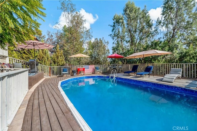 30451 San Pasqual Rd, Temecula, CA 92591 - view of swimming pool featuring a wooden deck, grilling area, and outdoor dining space