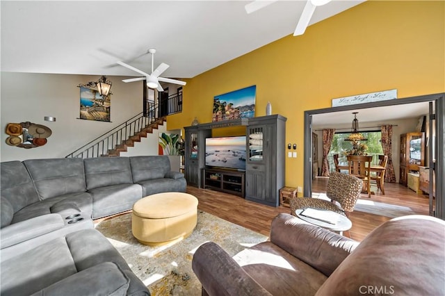 30451 San Pasqual Rd, Temecula, CA 92591 - living area with a ceiling fan, wood finished floors, a high ceiling, and stairs