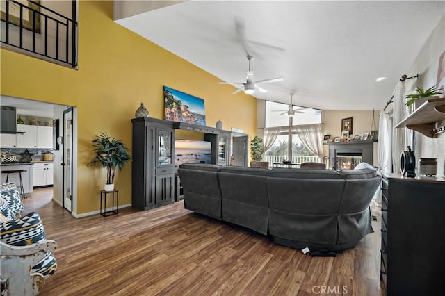 30451 San Pasqual Rd, Temecula, CA 92591 - living area with a ceiling fan, wood finished floors, and a glass covered fireplace