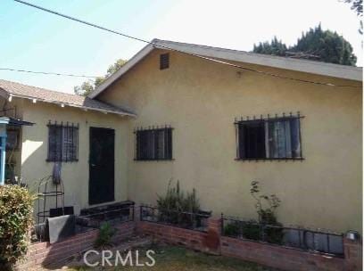 7223 Holmes Ave, Los Angeles, CA 90001 - view of front of home featuring stucco siding