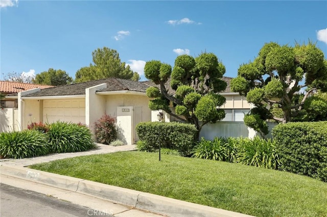 1917 Via Estudillo, Palos Verdes Estates, CA 90274 - view of front facade with an attached garage, a front yard, and stucco siding