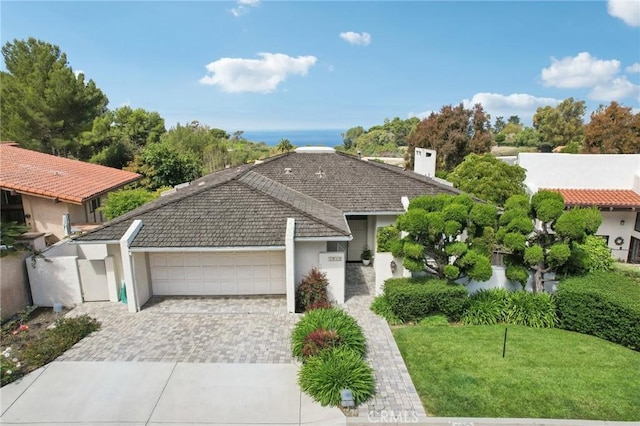1917 Via Estudillo, Palos Verdes Estates, CA 90274 - ranch-style home with an attached garage, decorative driveway, stucco siding, a chimney, and a front yard
