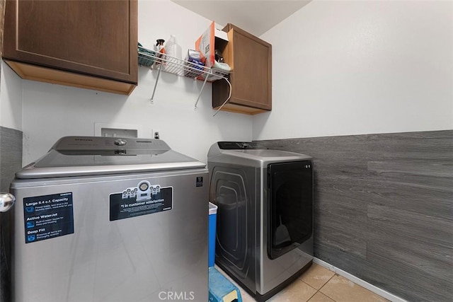 26833 Calico Ct, Winchester, CA 92596 - laundry area featuring washer and clothes dryer, cabinet space, and light tile patterned flooring