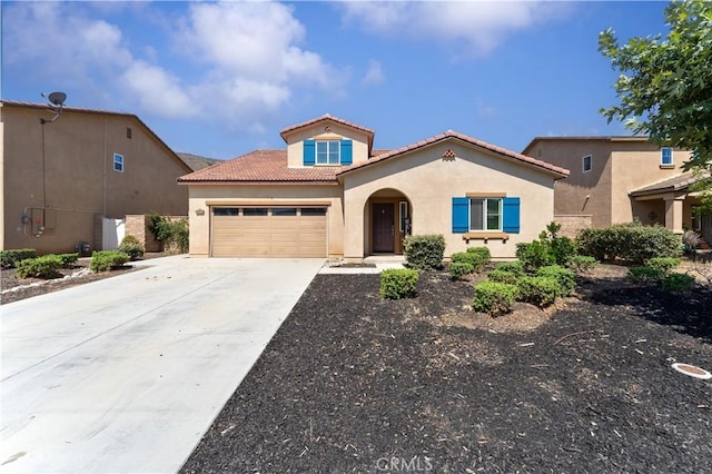 26833 Calico Ct, Winchester, CA 92596 - mediterranean / spanish-style home with a tile roof, stucco siding, concrete driveway, and a garage