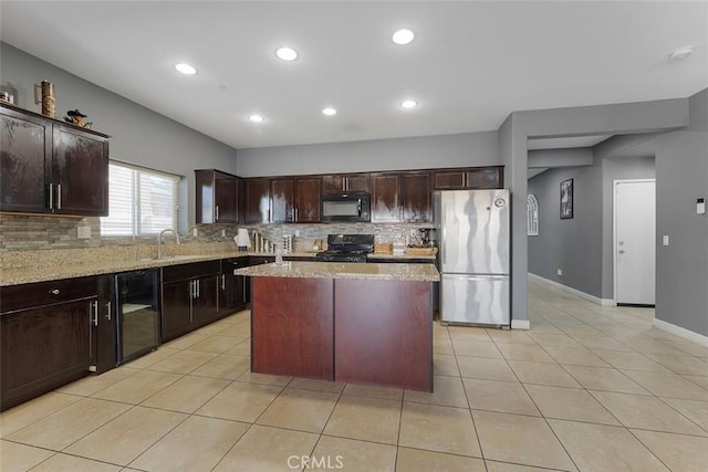 26833 Calico Ct, Winchester, CA 92596 - kitchen with black appliances, decorative backsplash, light tile patterned floors, light stone countertops, and recessed lighting