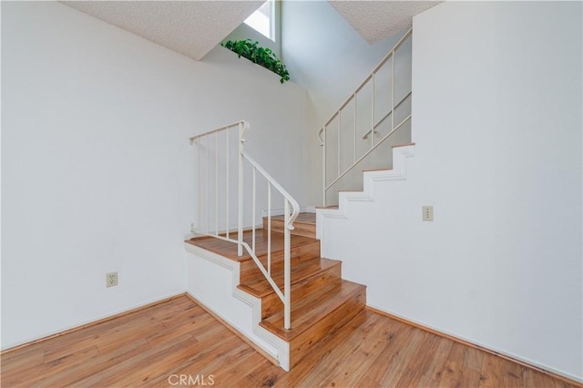 16944 Colchester Way Unit 174, Hacienda Heights, CA 91745 - stairs with wood finished floors and a textured ceiling