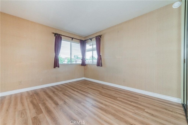 16944 Colchester Way Unit 174, Hacienda Heights, CA 91745 - empty room featuring light wood finished floors and wallpapered walls