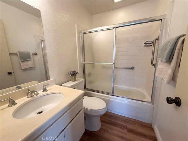 16944 Colchester Way Unit 174, Hacienda Heights, CA 91745 - full bath featuring wood finished floors, vanity, combined bath / shower with glass door, and a textured wall