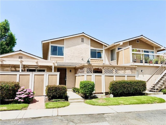 16944 Colchester Way Unit 174, Hacienda Heights, CA 91745 - view of front of house with stucco siding and stairway