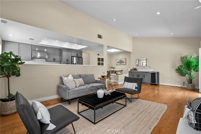 3891 Hunters Grove Ct, Moorpark, CA 93021 - living area featuring beverage cooler, light wood-style flooring, and recessed lighting