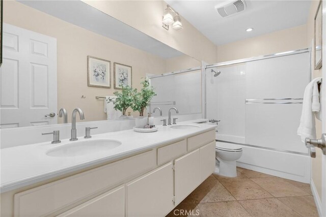 3891 Hunters Grove Ct, Moorpark, CA 93021 - bathroom with double vanity, bath / shower combo with glass door, tile patterned flooring, and recessed lighting