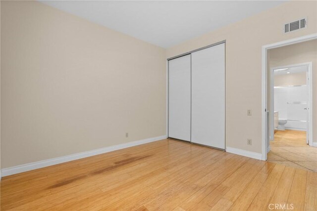 3891 Hunters Grove Ct, Moorpark, CA 93021 - unfurnished bedroom with light wood-style flooring and a closet