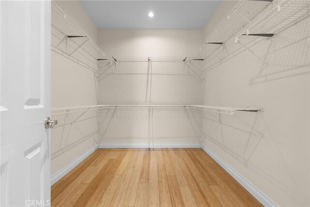 3891 Hunters Grove Ct, Moorpark, CA 93021 - walk in closet featuring wood finished floors