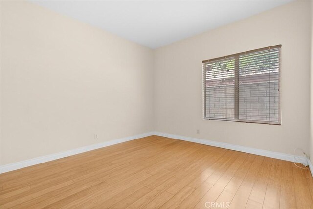 3891 Hunters Grove Ct, Moorpark, CA 93021 - spare room featuring baseboards and light wood-type flooring