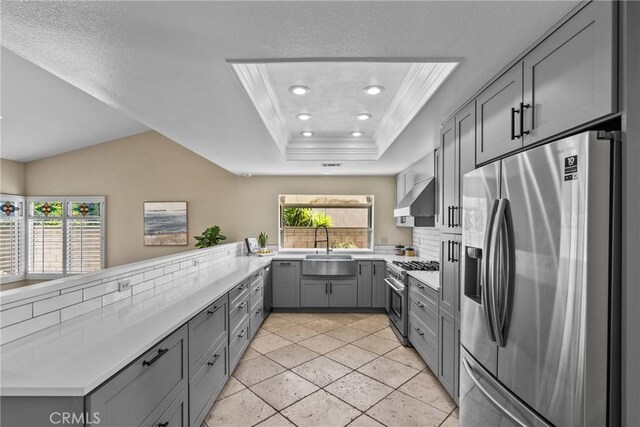3891 Hunters Grove Ct, Moorpark, CA 93021 - kitchen featuring appliances with stainless steel finishes, gray cabinetry, ventilation hood, light countertops, and recessed lighting