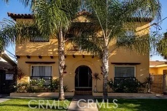 616 E Lomita Ave, Glendale, CA 91205 - view of front of property with stucco siding, a balcony, and a fenced front yard
