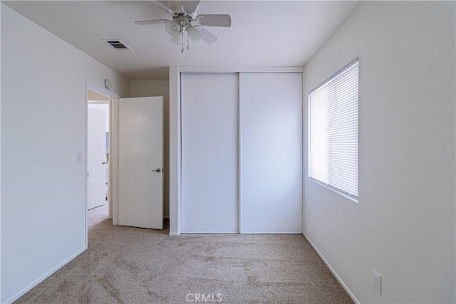1534 W Summerset Dr, Rialto, CA 92377 - unfurnished bedroom featuring carpet, a closet, and a ceiling fan