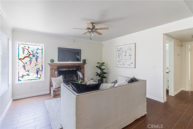 1534 W Summerset Dr, Rialto, CA 92377 - living room featuring ceiling fan, crown molding, a brick fireplace, and dark wood-style floors