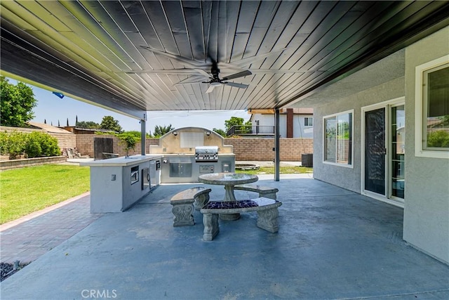1534 W Summerset Dr, Rialto, CA 92377 - fenced backyard featuring an outdoor kitchen, a patio, and a ceiling fan