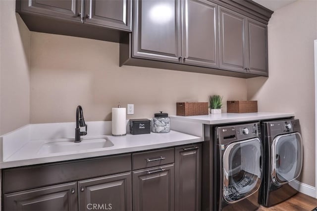 2564 Lunes Ln, Verne, CA 91750 - laundry room with cabinet space, washer and dryer, and wood finished floors