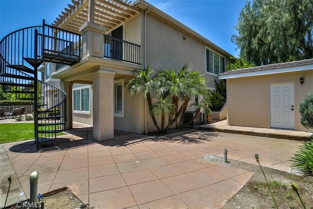 2564 Lunes Ln, Verne, CA 91750 - back of house with stairway, a patio area, stucco siding, and a balcony