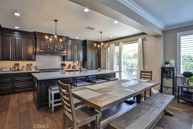 2564 Lunes Ln, Verne, CA 91750 - dining area with a chandelier, ornamental molding, dark wood-style floors, and recessed lighting
