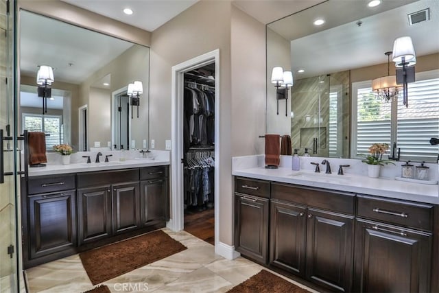 2564 Lunes Ln, Verne, CA 91750 - full bath featuring two vanities, a shower stall, a walk in closet, and recessed lighting