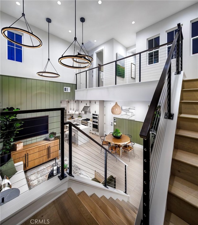 729 Oliver Ave, Placentia, CA 92870 - staircase featuring a high ceiling, recessed lighting, and wood finished floors