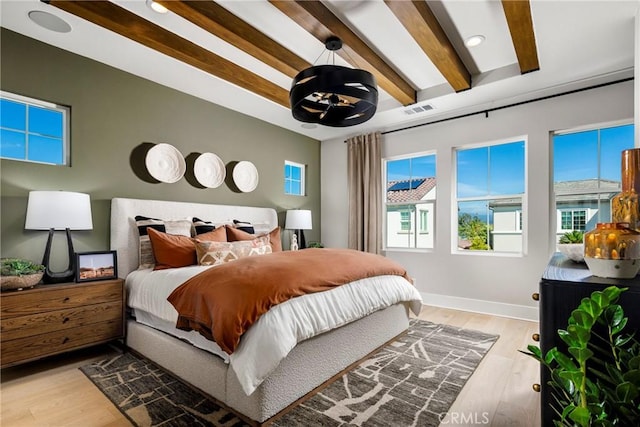 729 Oliver Ave, Placentia, CA 92870 - bedroom with multiple windows, light wood-type flooring, and beamed ceiling