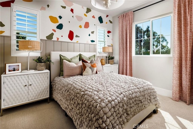 729 Oliver Ave, Placentia, CA 92870 - carpeted bedroom featuring wallpapered walls, multiple windows, a wainscoted wall, and an accent wall
