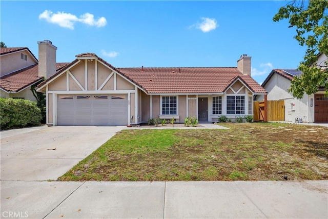 4706 Crestmont Pl, Oceanside, CA 92056 - view of front of property with an attached garage, stucco siding, driveway, a tile roof, and a gate