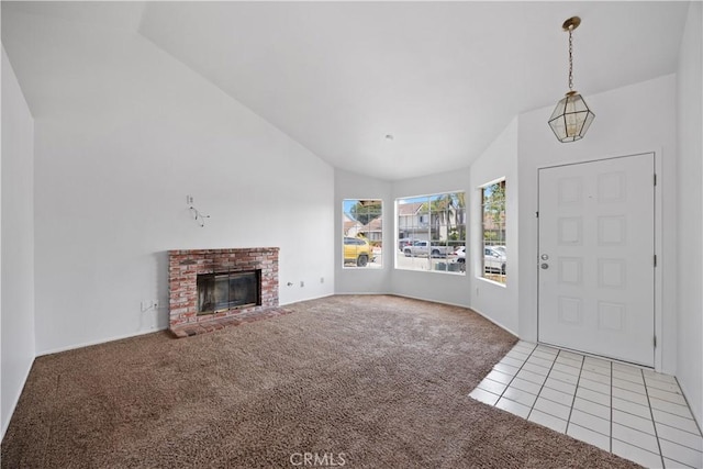 4706 Crestmont Pl, Oceanside, CA 92056 - foyer with lofted ceiling, light carpet, a fireplace, and light tile patterned floors