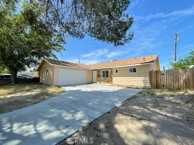 45541 Sancroft Ave, Lancaster, CA 93535 - ranch-style house with a garage and driveway