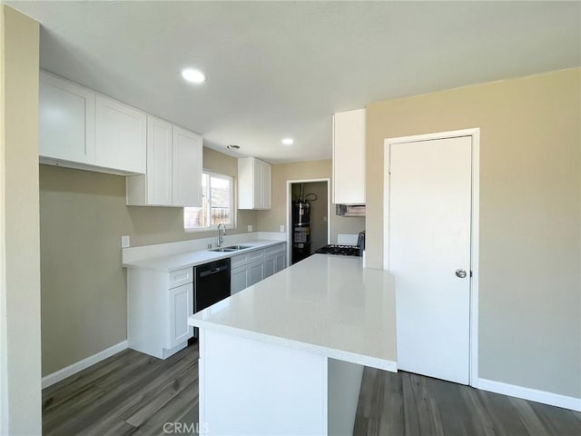 45541 Sancroft Ave, Lancaster, CA 93535 - kitchen featuring dark wood-type flooring, white cabinets, light countertops, black dishwasher, and recessed lighting