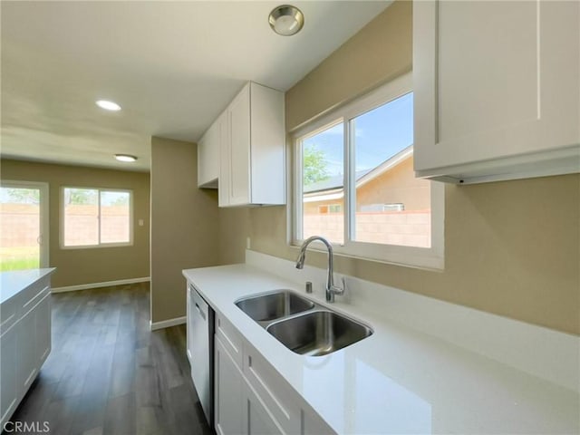 45541 Sancroft Ave, Lancaster, CA 93535 - kitchen with recessed lighting, light countertops, white cabinetry, dark wood-style flooring, and stainless steel dishwasher