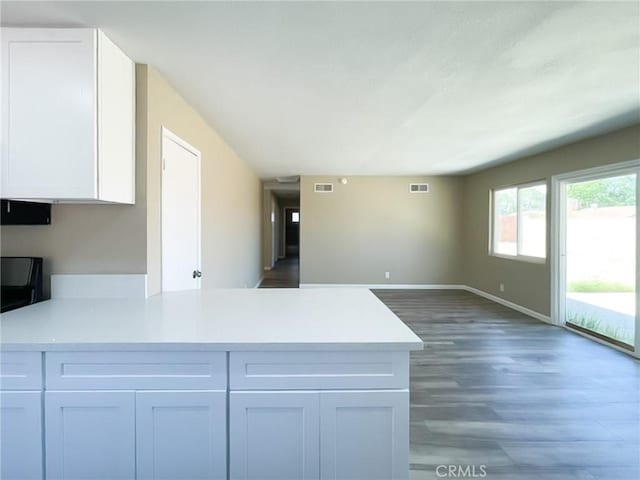 45541 Sancroft Ave, Lancaster, CA 93535 - kitchen with a peninsula, light countertops, white cabinets, and open floor plan