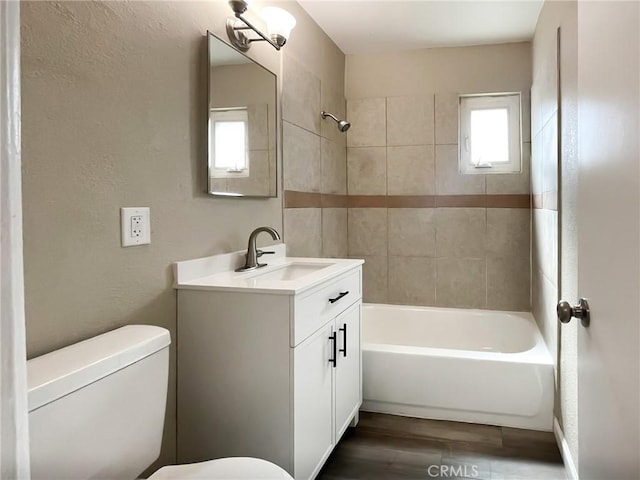 45541 Sancroft Ave, Lancaster, CA 93535 - full bathroom with vanity, shower / tub combination, and wood finished floors