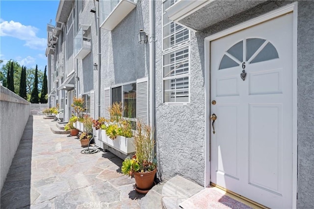 14853 Hartsook St Unit 106, Sherman Oaks, CA 91403 - property entrance with stucco siding and a patio