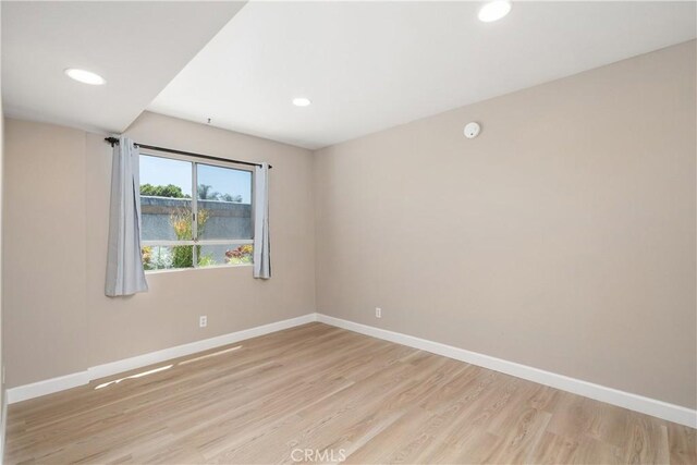 14853 Hartsook St Unit 106, Sherman Oaks, CA 91403 - spare room with light wood finished floors, recessed lighting, and a smoke detector