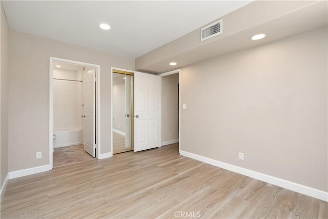14853 Hartsook St Unit 106, Sherman Oaks, CA 91403 - unfurnished bedroom with light wood finished floors, recessed lighting, and ensuite bathroom