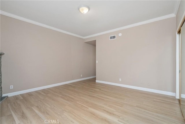 14853 Hartsook St Unit 106, Sherman Oaks, CA 91403 - spare room featuring ornamental molding and light wood finished floors
