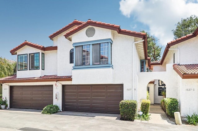 1527 Apache Dr Unit B, Chula Vista, CA 91910 - mediterranean / spanish-style home featuring a tile roof, a garage, and stucco siding