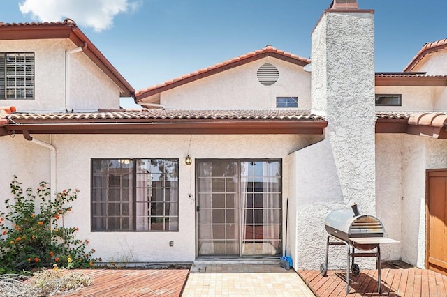 1527 Apache Dr Unit B, Chula Vista, CA 91910 - back of property with a deck, stucco siding, and a tiled roof