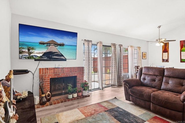 1527 Apache Dr Unit B, Chula Vista, CA 91910 - living room with wood finished floors, a fireplace, a ceiling fan, and lofted ceiling