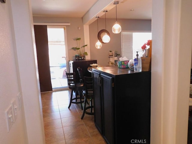 10947 Mesa Linda St, Victorville, CA 92392 - bar featuring light tile patterned flooring and pendant lighting