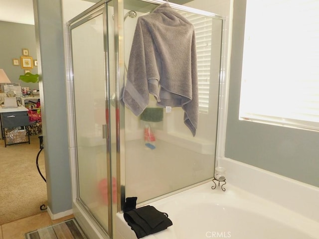 10947 Mesa Linda St, Victorville, CA 92392 - bathroom featuring a stall shower and a bath